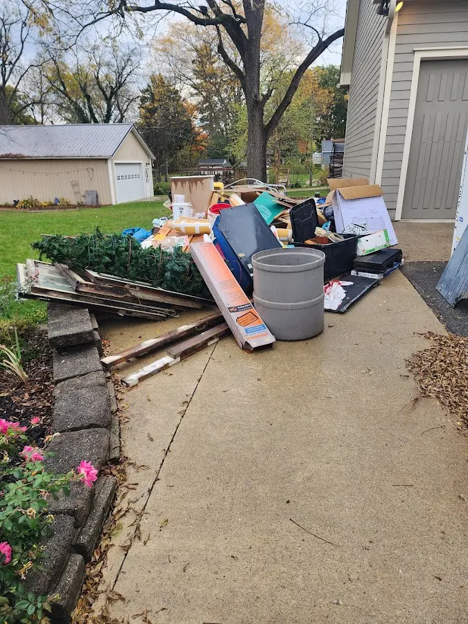 Dumpster being loaded with debris for 30 Yard Dumpster Rental in Orange City
